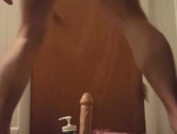 Dildo fucking mad beauty picking up a rod.