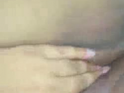 Fat bitch is playing with her smooth pussy and ass, in a massage room, during the day.
