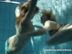 zuzanna and lucie toying underwater